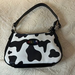 Delia’s cow print purse, pre-loved.